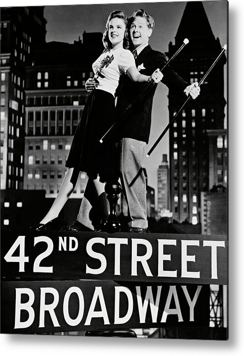 Judy Garland Metal Print featuring the photograph MICKEY ROONEY and JUDY GARLAND in BABES ON BROADWAY -1941-. #1 by Album