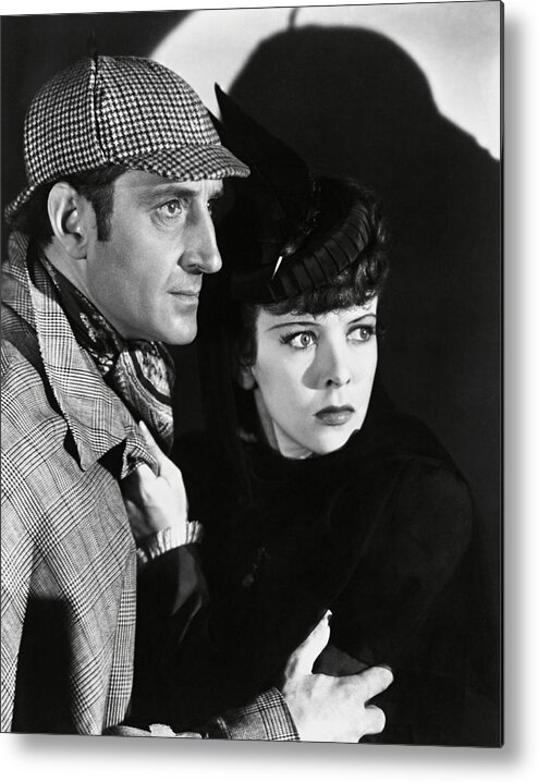 Basil Rathbone Metal Print featuring the photograph BASIL RATHBONE and IDA LUPINO in THE ADVENTURES OF SHERLOCK HOLMES -1939-. by Album