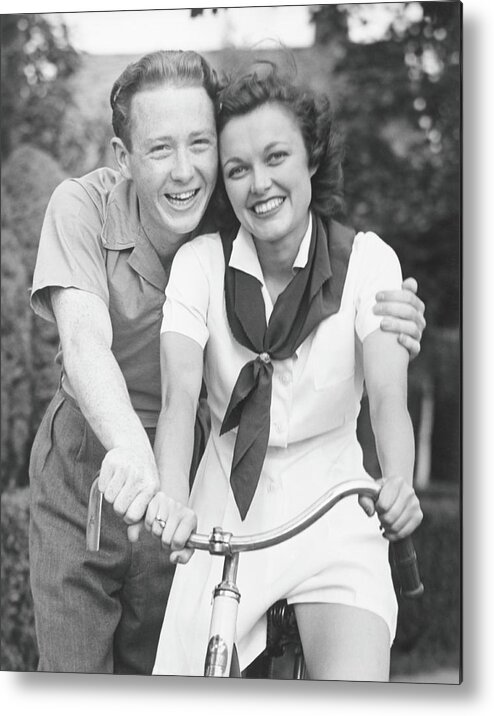 Young Men Metal Print featuring the photograph Man Embracing Woman Sitting On Bike by George Marks
