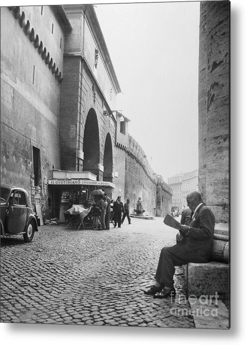 People Metal Print featuring the photograph Man Reading Newspaper By Cobblestone by Bettmann