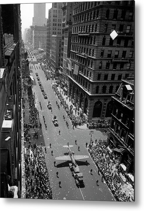 Usa Metal Print featuring the photograph Model of plane on float in New York at War Independence Day parade up Fifth Avenue. by Andreas Feininger