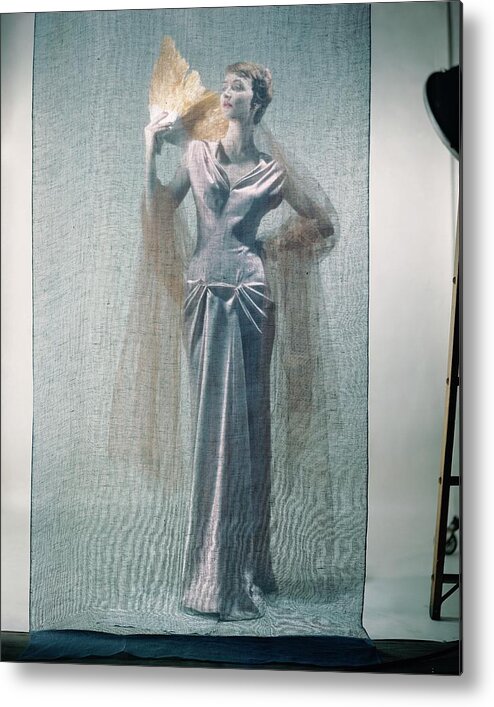 #new2022vogue Metal Print featuring the photograph Model With Fan Behind Scrim by Erwin Blumenfeld