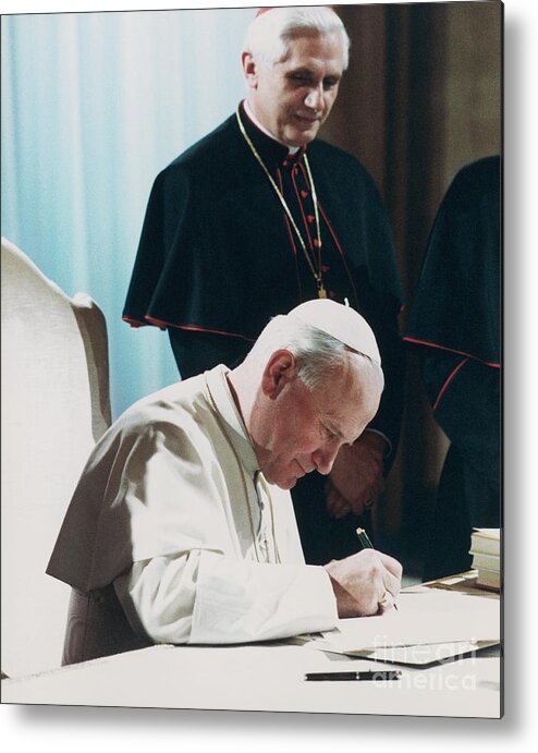 1980-1989 Metal Print featuring the photograph Pope John Paul II And Cardinal Ratzinger by Bettmann