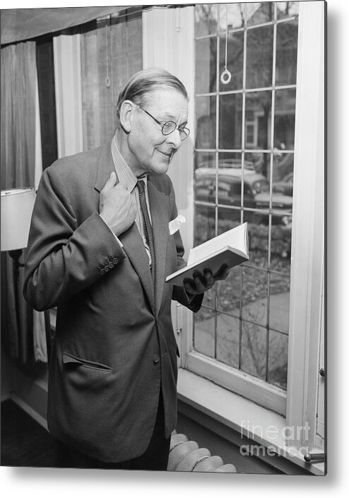 Working Metal Print featuring the photograph T.s. Eliot Reviews Early Poetry by Bettmann