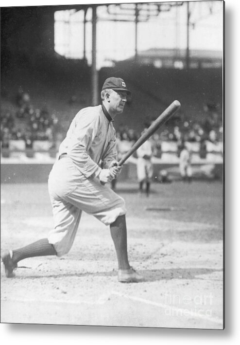 Baseball Cap Metal Print featuring the photograph Ty Cobb Swinging A Baseball Bat by Bettmann