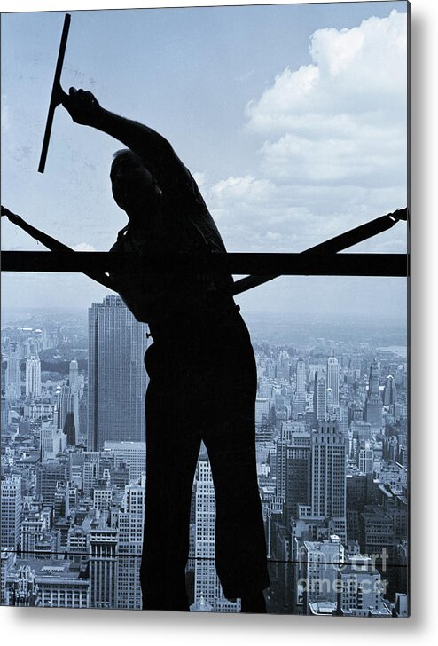Working Metal Print featuring the photograph Window Washer Cleaning Skyscraper by Bettmann