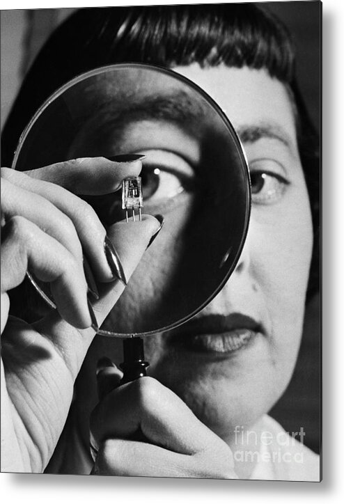 People Metal Print featuring the photograph Woman Inspecting Transistor, 1948 by Bettmann