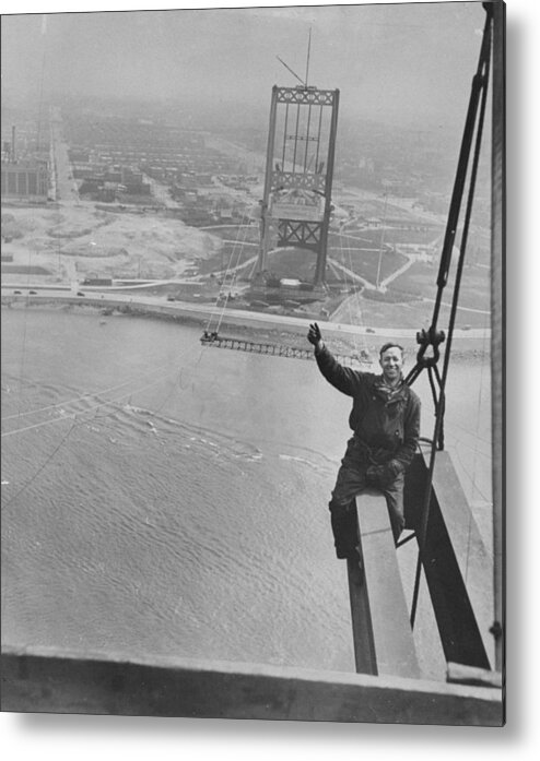 1930-1939 Metal Print featuring the photograph Workman Sam Genier Waves From Girder On by New York Daily News Archive