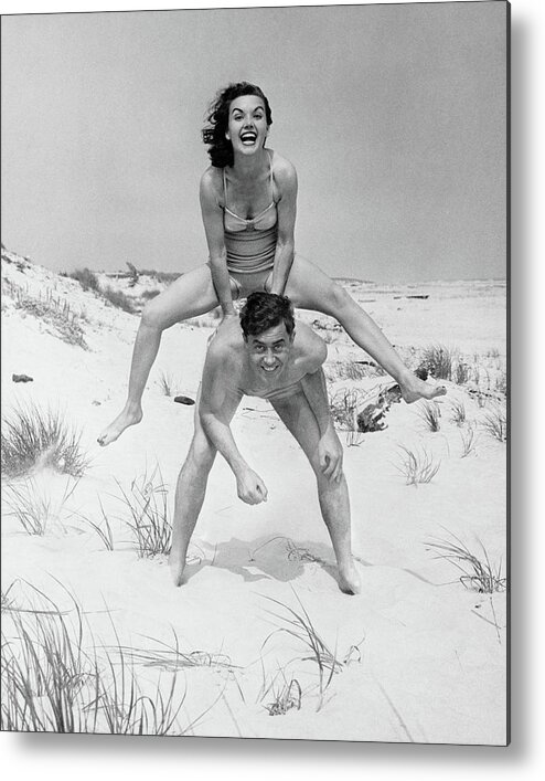 Young Men Metal Print featuring the photograph Young Couple On Beach, Woman by George Marks