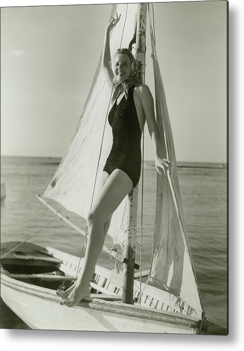 Human Arm Metal Print featuring the photograph Young Woman Posing On Sailboat by George Marks