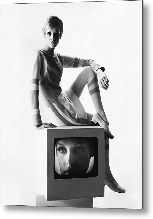 Model Metal Print featuring the photograph Twiggy Atop A Television Box by Bert Stern
