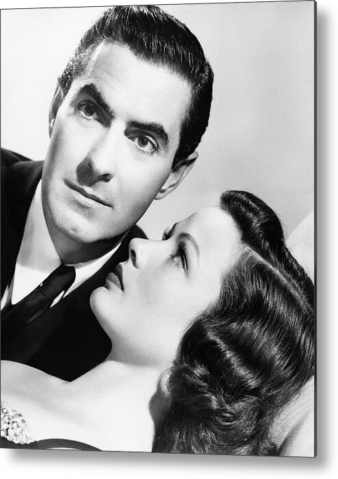 Gene Tierney Metal Print featuring the photograph TYRONE POWER and GENE TIERNEY in THE RAZOR'S EDGE -1946-, directed by EDMUND GOULDING. by Album