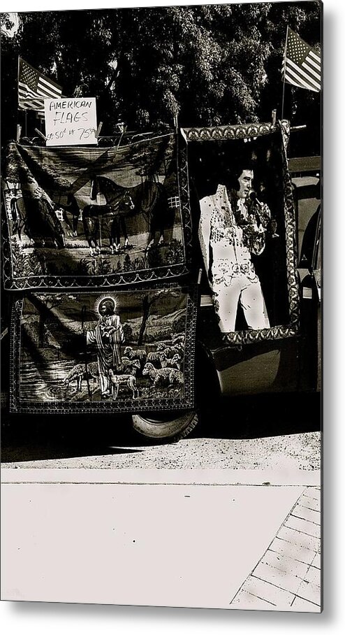 Vendor Selling American Flags Elvis Presley And Jesus Christ Tapestries Armory Park Tucson Arizona Black And White Toned Metal Print featuring the photograph Vendor selling American flags Elvis Presley and Jesus Christ tapestries Armory Park Tucson Arizona by David Lee Guss