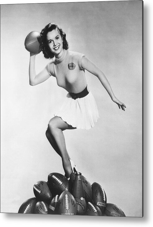 1950's Metal Print featuring the photograph Debbie Reynolds Throws A Pass by Underwood Archives