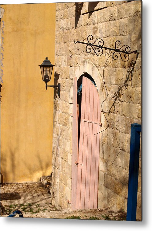 Door Metal Print featuring the photograph Door and streetlight. by Arik Baltinester