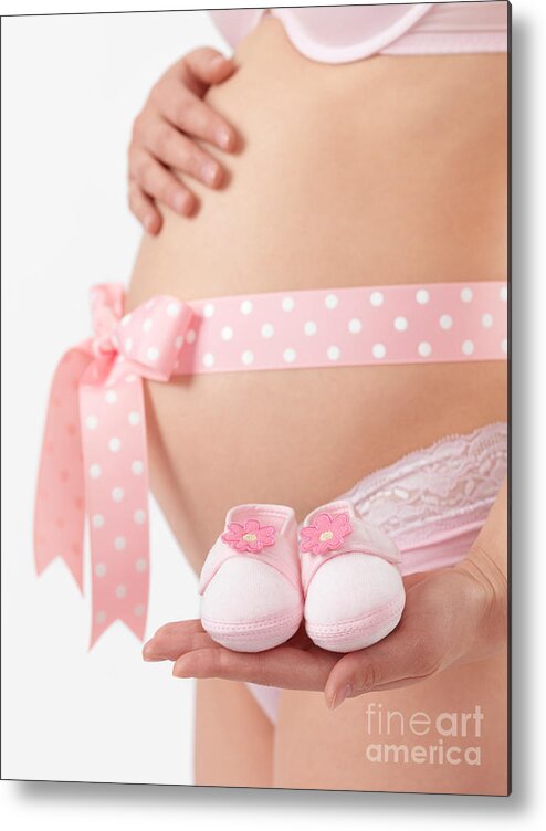 Pregnant Metal Print featuring the photograph Pregnant Woman Holding Pink Baby Shoes by Maxim Images Exquisite Prints