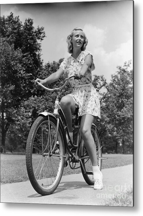 1930s Metal Print featuring the photograph Teeng Girl Riding Bike On Sidewalk by H. Armstrong Roberts/ClassicStock