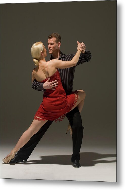Coordination Metal Print featuring the photograph Man And Woman Dancing Tango by Pm Images