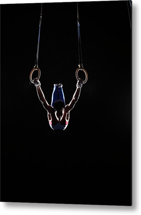 Hanging Metal Print featuring the photograph Teenage 16-17 Male Gymnast Practicing by Thomas Barwick