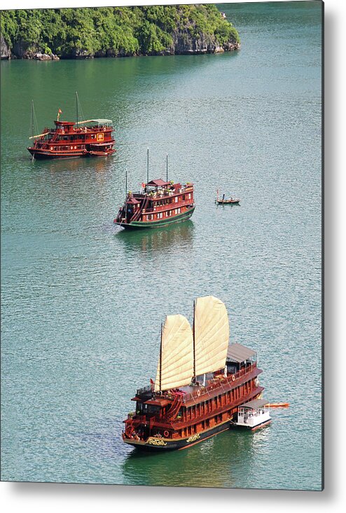 Seascape Metal Print featuring the photograph Tourist wooden Boats at Halong Bay Vietnam by Michalakis Ppalis