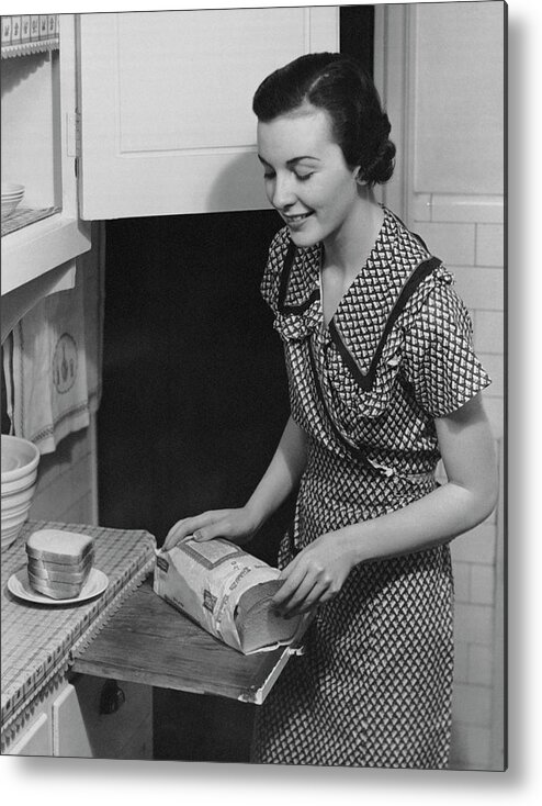 Three Quarter Length Metal Print featuring the photograph Woman Placing Bread On Plate by George Marks