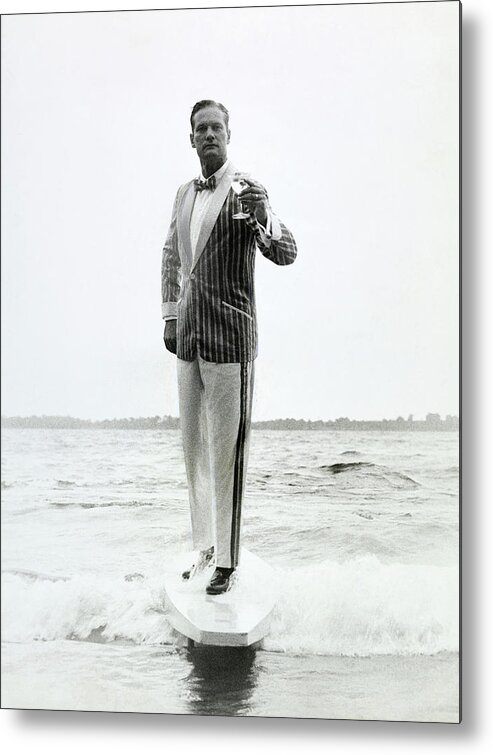 Menswear Metal Print featuring the photograph A Model Stands In The Surf In Bronzini by Richard Waite