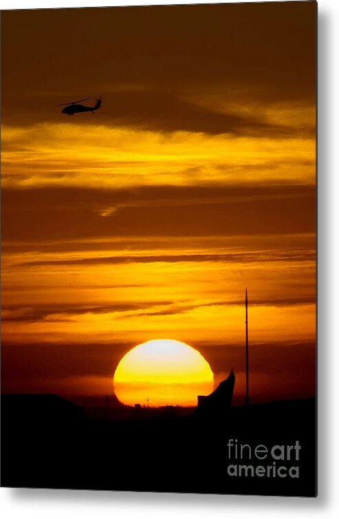 Military Metal Print featuring the photograph A Uh-60 Black Hawk Helicopter Flies by Stocktrek Images