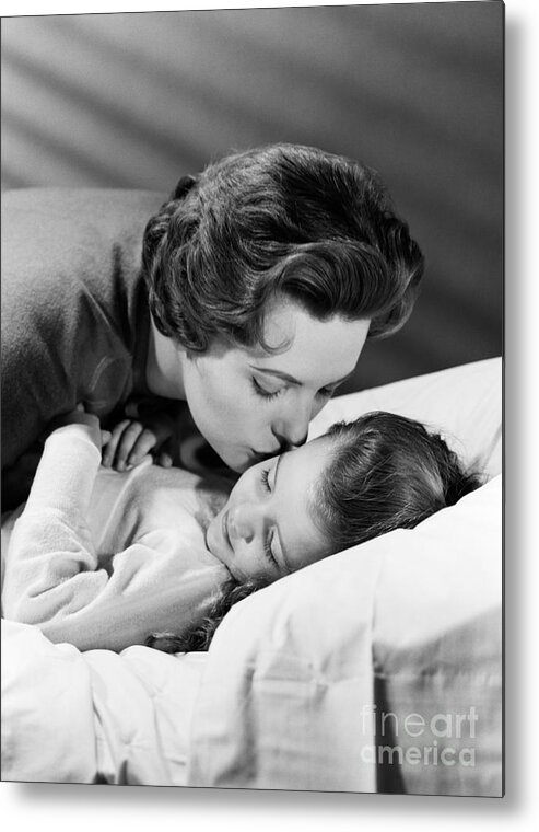 1950s Metal Print featuring the photograph Mother Kissing Girl Goodnight, C.1950s by H. Armstrong Roberts/ClassicStock