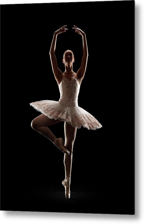 Ballet Dancer Metal Print featuring the photograph Ballerina In Releve Pose by Lewis Mulatero