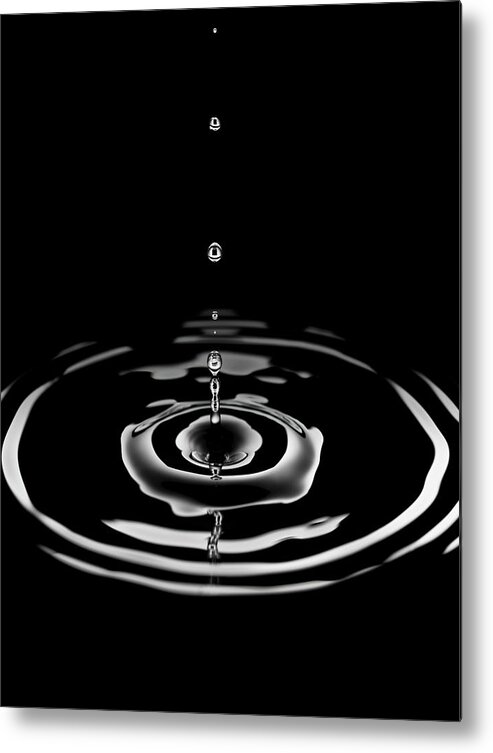 Tranquility Metal Print featuring the photograph Single Drop Of Water Forming Rings In by Pier