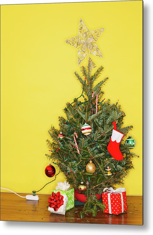 Large Group Of Objects Metal Print featuring the photograph Small Christmas Tree Against Yellow by Tetra Images