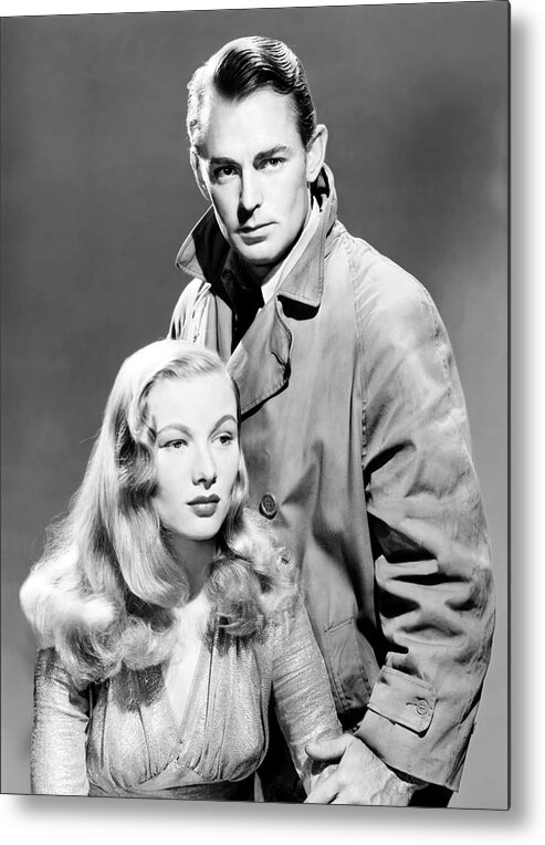 Alan Ladd Metal Print featuring the photograph ALAN LADD and VERONICA LAKE in THIS GUN FOR HIRE -1942-, directed by FRANK TUTTLE. by Album