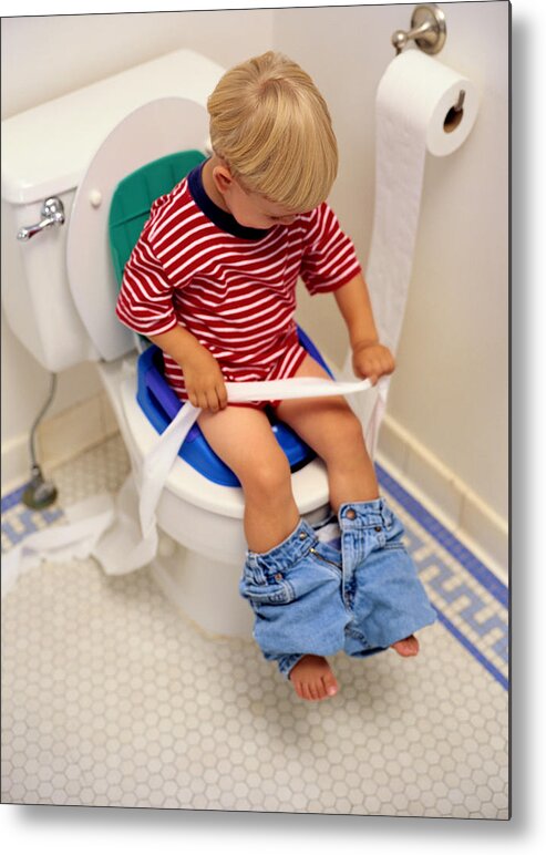 Sequential Series Metal Print featuring the photograph Boy Sitting on a Potty Chair With Toilet Paper by Ryan McVay