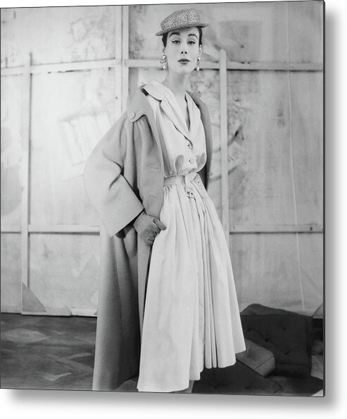 Eye Contact Metal Print featuring the photograph Model Wearing A Givenchy Coat by Henry Clarke