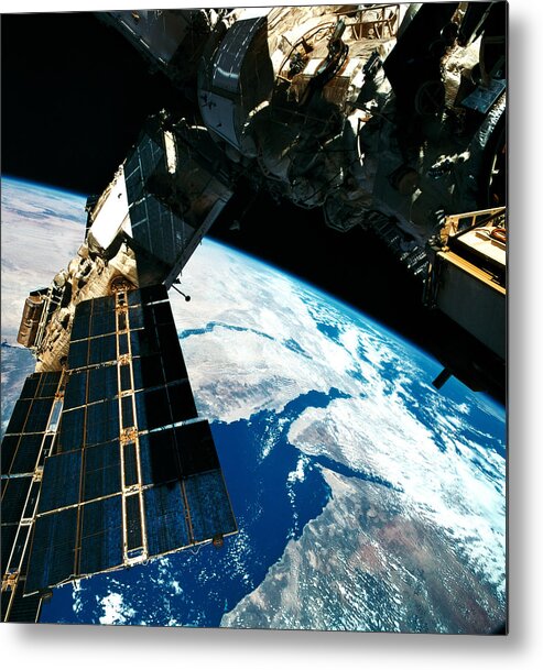 Square Metal Print featuring the photograph A Satellite Orbiting Above The Earth #1 by Stockbyte