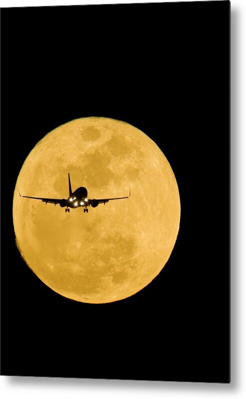 Moon Metal Print featuring the photograph Aeroplane Silhouetted Against A Full Moon by David Nunuk
