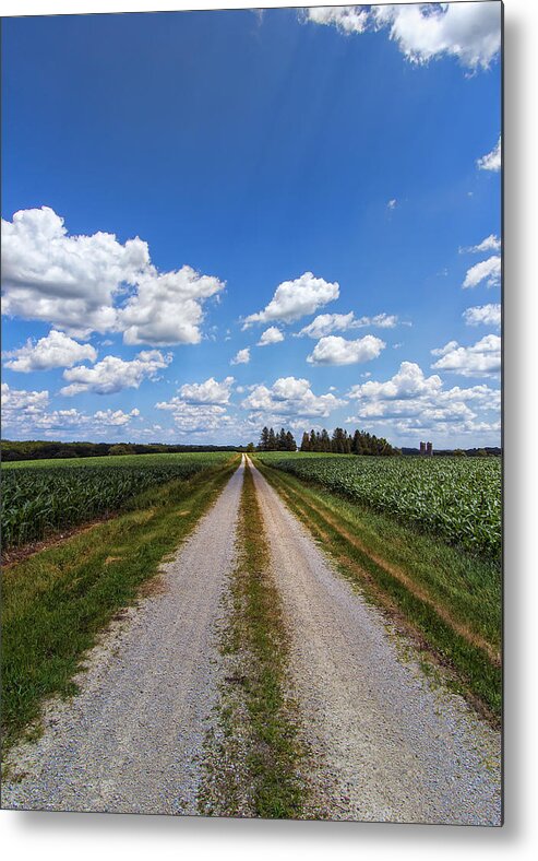 Sky Metal Print featuring the photograph A Long Rural Road by Bill and Linda Tiepelman