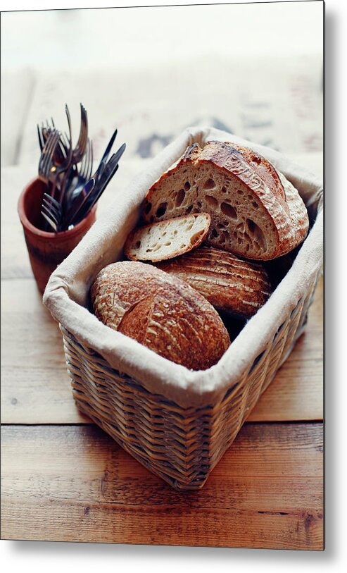 Bakery Metal Print featuring the photograph Basket Of Artisan Bread On Wooden Table by Jake Curtis