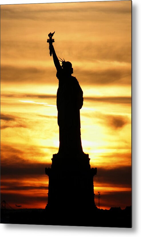 Sunset Metal Print featuring the photograph Statue of Liberty Silhouette by Bob Slitzan