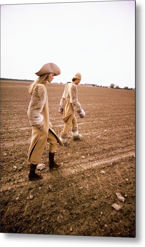 Fashion Metal Print featuring the photograph Models Wearing Jacques Tiffeau Coats by Arnaud de Rosnay