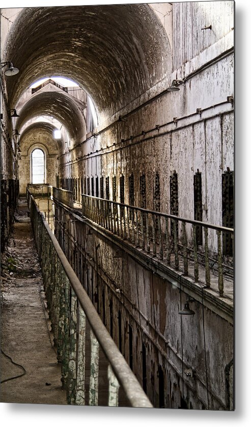 Eastern State Penitentiary Metal Print featuring the photograph Ominous Corridor by Michael Dorn