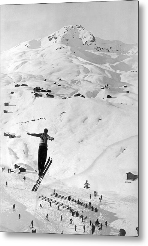 1937 Metal Print featuring the photograph Skier Leaping Over A Valley by Underwood Archives