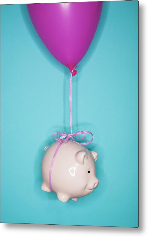 Working Metal Print featuring the photograph Studio Shot Of Piggy Bank Lifted By by Tetra Images