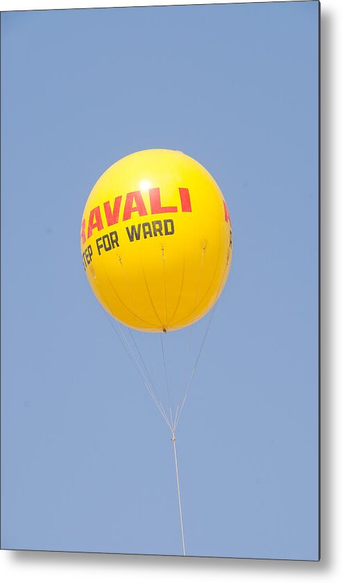 Balloon Metal Print featuring the photograph A hot air balloon in the blue sky by Ashish Agarwal