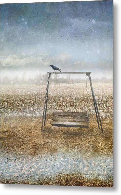 Atmospheric Metal Print featuring the photograph Abandoned swing in first snow storm of winter by Sandra Cunningham