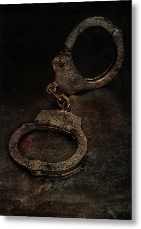 Still Life Metal Print featuring the photograph Still life with old rusty handcuffs by Jaroslaw Blaminsky