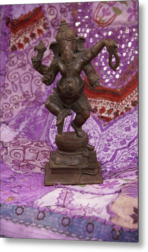 Ganesh Metal Print featuring the photograph Bronze Ganesha dancing, on purple by Steve Estvanik