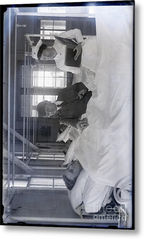 People Metal Print featuring the photograph Dr Rosalie S Morton, Holding Patient by Bettmann