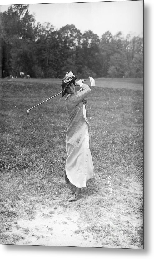 People Metal Print featuring the photograph Lillian Hyde Swings Golf Club by Bettmann