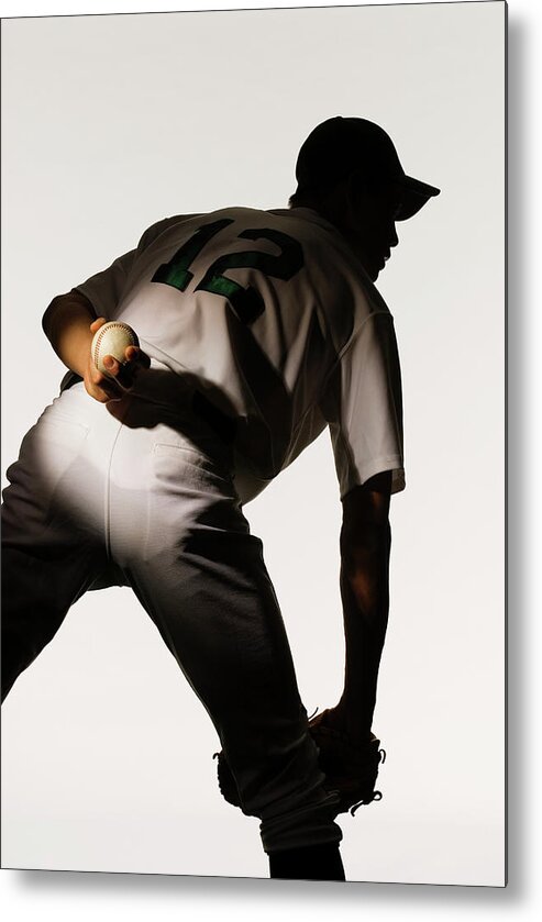 Three Quarter Length Metal Print featuring the photograph Silhouette Of Baseball Pitcher Holding by Pm Images